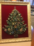 Costume jewelry Christmas tree matted on old frame.