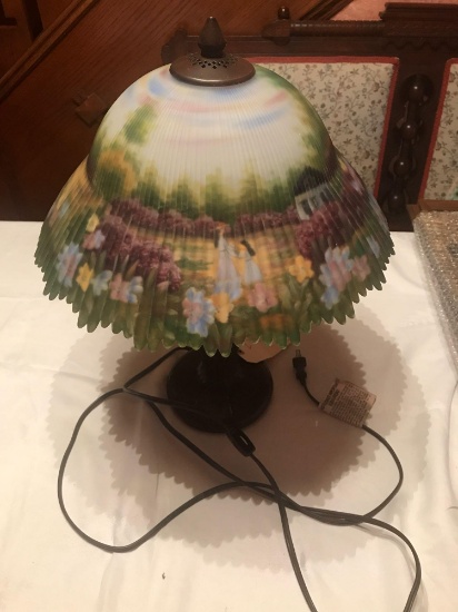 8" tall lamp with brass base and reverse paint shade. Nice