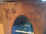 Oak secretary cabinet with oval glass front display