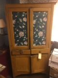 Pine kitchen cupboard with doors on top, two drawers in the middle, and two doors at the bottom,