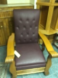 Oak reclining leather chair with lion hand rest and lion front feet, excellent condition.
