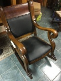 Oak sturdy rocker with claw feet on the front runners, leather seat and back (Excellent condition)