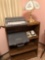 30'' x 42'' 3-shelf bookshelf, smith corona electric typewriter, desk lamp and countertop