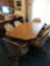 41'' x 52'' Formica top table with 1-18'' leaf and 6-cloth rolling chairs NO SHIPPING
