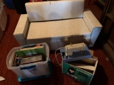 Child's size sofa, child's sewing Machine in original box plus various child's story books. NO