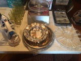 Oreck iron with stand, 8 water glasses, various stainless serving trays and bowl, footed cake stand,