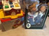 Fisher-price discovery school house and Geppeddo Kyle and Katie kissing dolls.