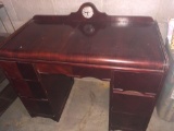 20'' x 40'' waterfall kneehole desk with clock. No warranty of clock working condition- Overall nice