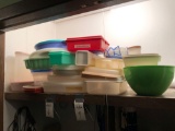 Various Tupperware containers and other plastic containers plus various cookie sheets, cake sheets