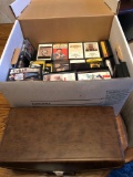 Leather cassette carrier full of cassettes and box full of cassette tapes