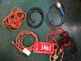 various extension cords, surge strips and trouble light