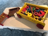 2 Playskool Wooden wagons with wooden wheI els, accessories, carpenters workbench. No Shipping