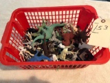 Basket full of plastic animals. Shipping