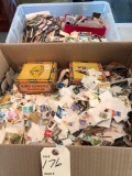 Two boxes of stamps from all over the world. Shipping