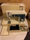 Singer portable sewing machine with carrying case. No shipping
