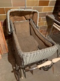 Keywood Wakefield large wicker baby buggy on 4 wheels, and hidden bottom compartment (above average