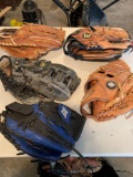 Five baseball gloves. Shipping
