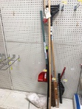 Assortment of Brooms, Mops, and Handles