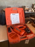 Paslode Impulse cordless nailer with two batteries and battery charger in case. Shipping