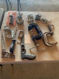 Assortment of C clamps, dry wall saws. No shipping
