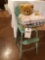 Metal doll high chair w/steel tray, teddy bear w/ Pioneer t-shirt.