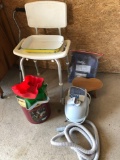 Handicap shower chair, cane, tins, enamel white/green/yellow cake pan, and Conair bath mat w/remote