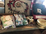 Various Christmas decor, Christmas tablecloths, entrance rug, and 24'' pre-lit wreath.