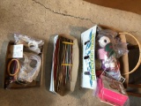 Various knitting needles, yarn, and accessories.