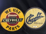 2 round Chevrolet signs