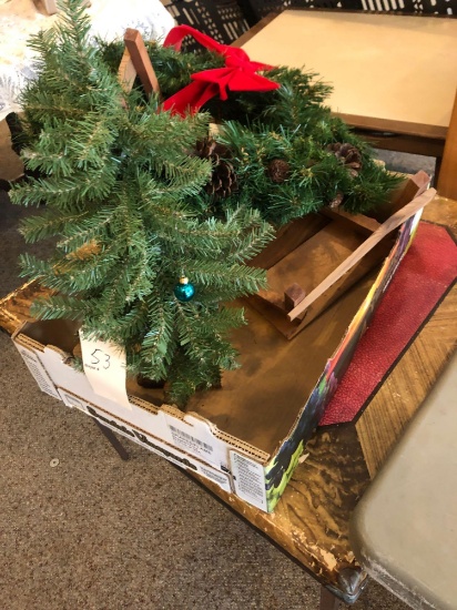 Tote w/ Christmas wreath and nativity items.