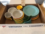 Various dinner plates, berry bowls and coffee cups.