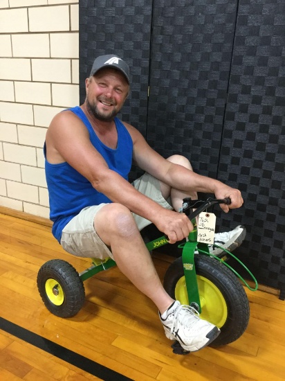 John Deere mighty tricycle (Donated by: cash donors)