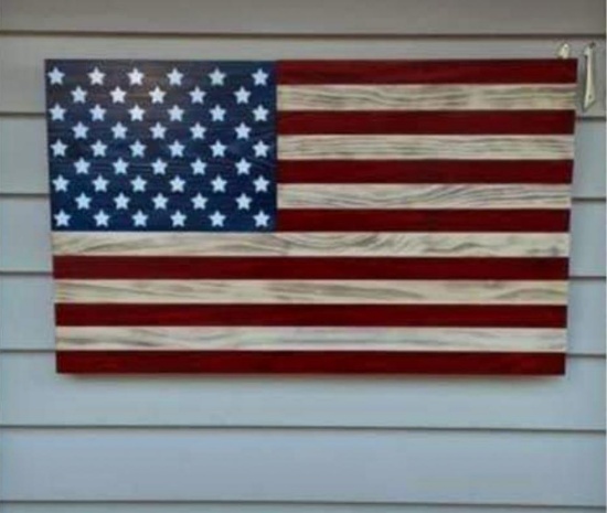 19.5 x 32 handcrafted wooden American flag (made by: Paul & Heidi Hartman) (Donated by: cash donors)
