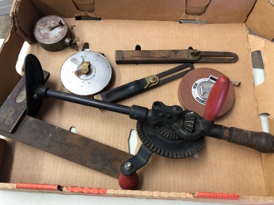 Antique brace drill, slide rule, measuring tapes and small square