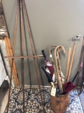 Wooden nail keg with 6 old umbrellas, 2 canes, 3 yard sticks. NO SHIPPING.