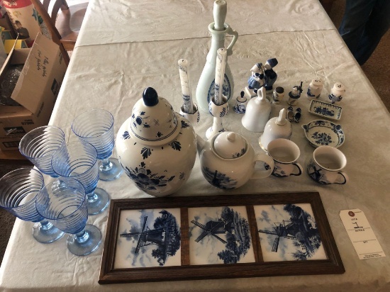 Several Delft pieces including cookie jar, teapot, cups, bells, kissing boy and girl, salt and