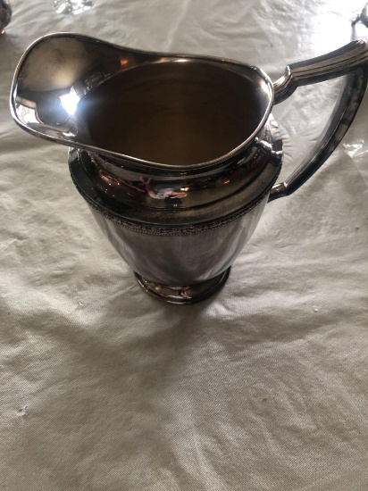 Rogers silver water pitcher and 52" x 70" polishing rag