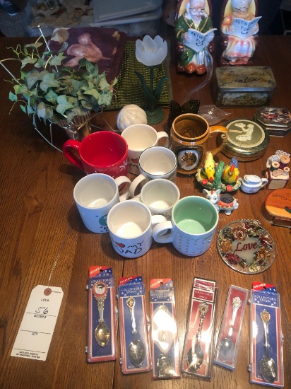 Collector spoons, various coffee cups, collectible tin and retirement piggy bank.