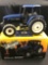 1/16 scale Ertl 1997 Toy Farmer New Holland 8260 MFD Tractor w/Box