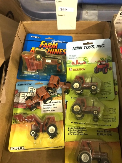 Assortment of 1/64 Scale Ertl Hesston Tractors and Machinery