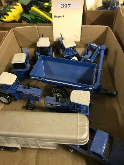 Assortment of 1/64 Scale Ertl Ford Tractors and More
