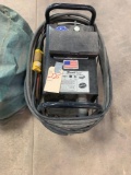 Thermal Dynamics Cutmaster 38 plasma cutter with cart and cover.