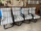 4 Metal swivel rocking cushioned patio chairs.