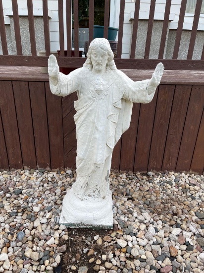 Cement outdoor statue of the Sacred Heart of Jesus.