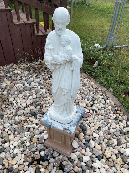 Cement outdoor statue of St Joseph with Baby Jesus.