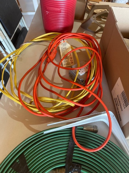 3 watering hoses, lightbulbs, extension cord, thermos.