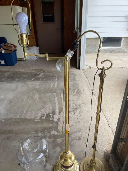 Plastic water dispenser, two floor lamps.