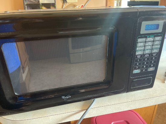 Whirlpool microwave with turntable, 2 iron framed cushioned swivel seat bar stools.