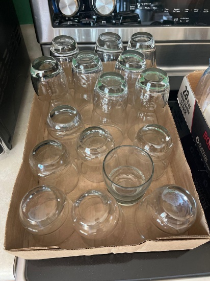 Misc. drinking glasses, glass syrup dispenser, white salt and pepper shaker, white butter dish with