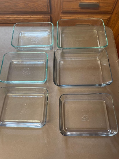 Various sizes and shapes of Pyrex, corning Ware, and anchor glass baking dishes and storage